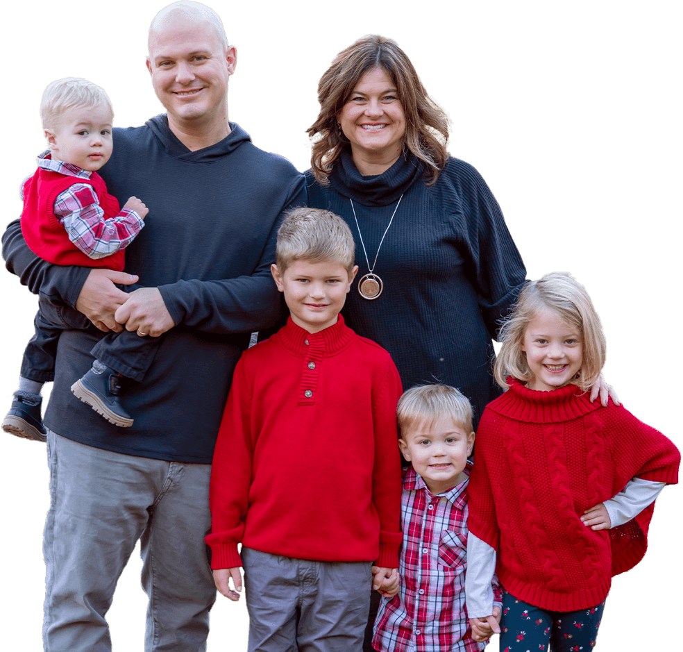 Chris Valentine with his wife and four children standing outdoors